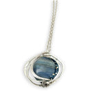 Large smooth oval kyanite gemstones encircled in hammered sterling silver and blue crystal gemstone necklace