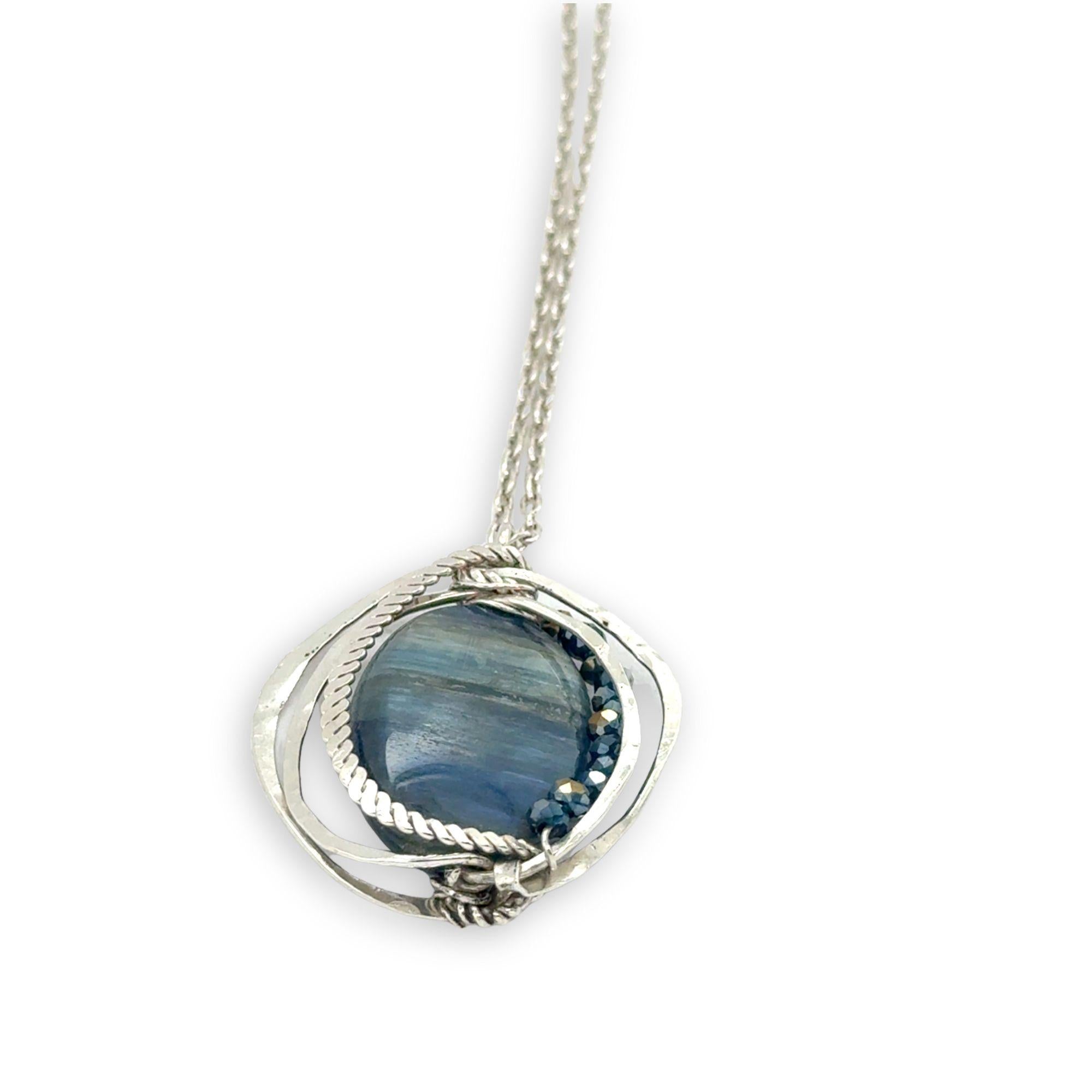 Large smooth oval kyanite gemstones encircled in hammered sterling silver and blue crystal gemstone necklace