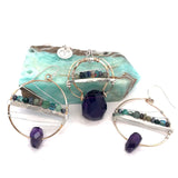 Handmade hammered bronze pendant with built in amethyst nugget, accented with opal and green amethyst on sterling silver wire, featuring a sterling silver chain