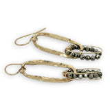 Handmade hammered brass mini oval holding a pyrite loop wrapped in gold filled wire earrings