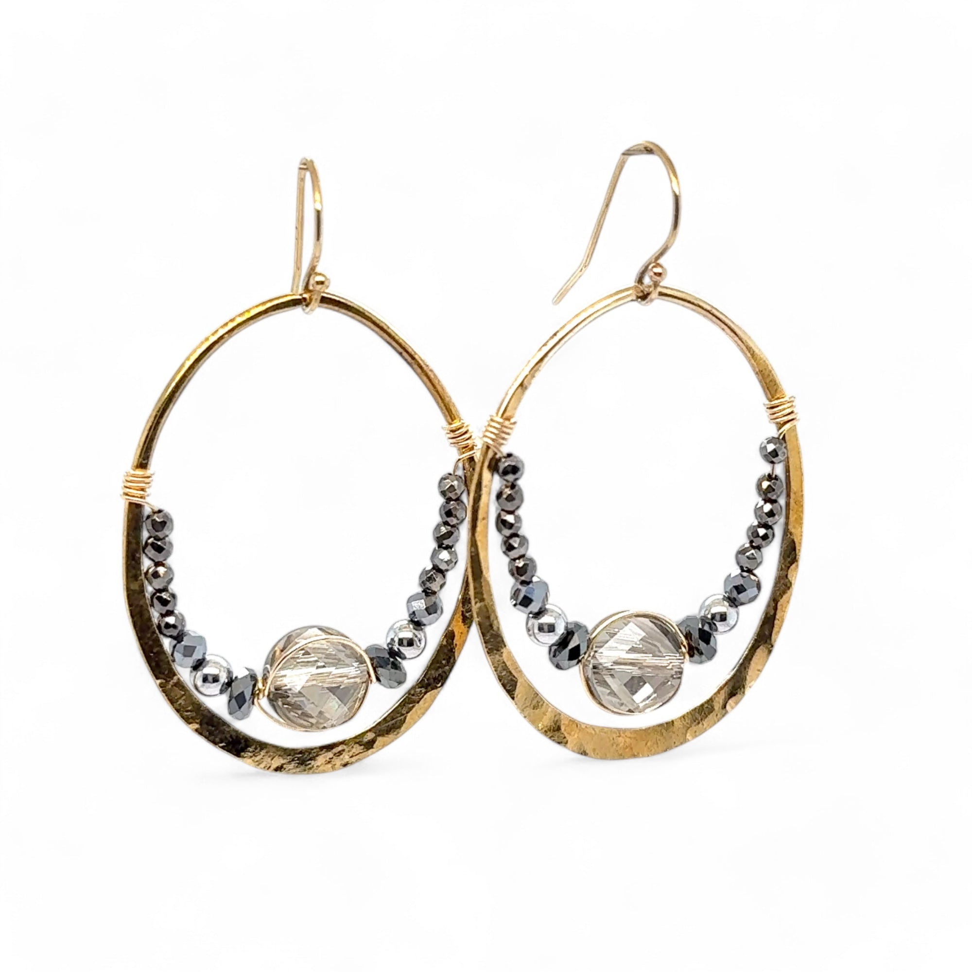 pyrite gemstones mixed with a silver sparkling coin crystal wrapped in gold filled wire inside a brass hammered hoop on gold filled earring hooks