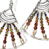 A pair of sterling silver fan earrings with micro faceted hessonite garnet gemstones and crystal