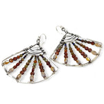 A pair of sterling silver fan earrings with micro faceted hessonite garnet gemstones and crystal