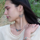 light, sparkly sterling silver hand formed channel hoop earrings with blue opals, blue tourmaline, iolite and pyrite gemstones accented with brass twist wire