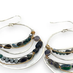 light, sparkly sterling silver hand formed channel hoop earrings with blue opals, blue tourmaline, iolite and pyrite gemstones accented with brass twist wire