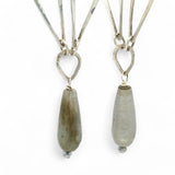 Handmade hammered sterling silver drops on an arch earring with labradorite teardrop dangle earring