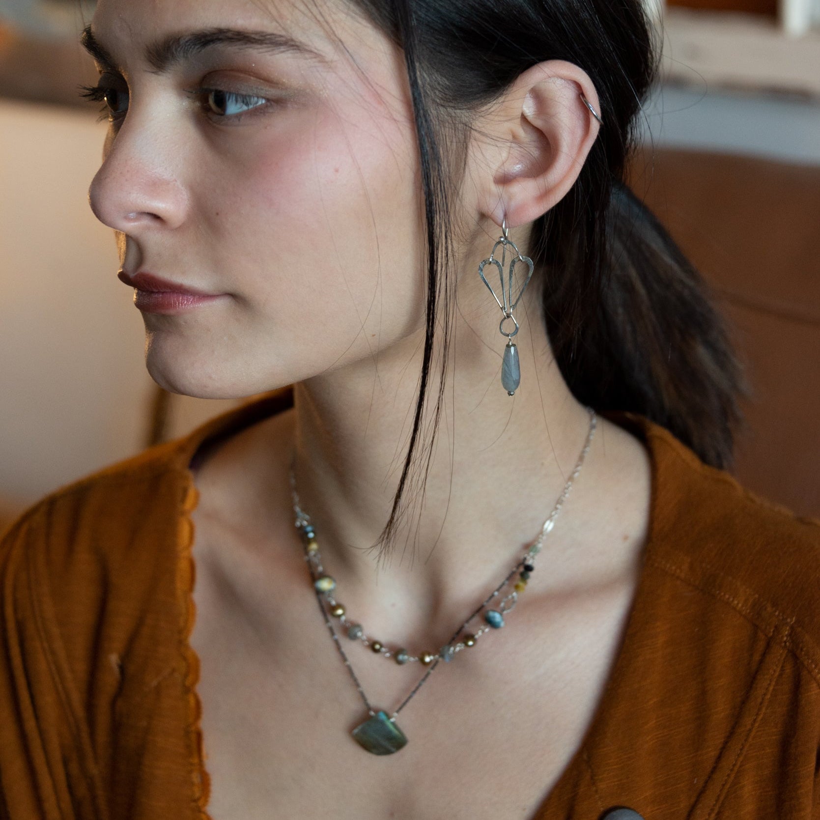 Handmade hammered sterling silver drops on an arch earring with labradorite teardrop dangle earring