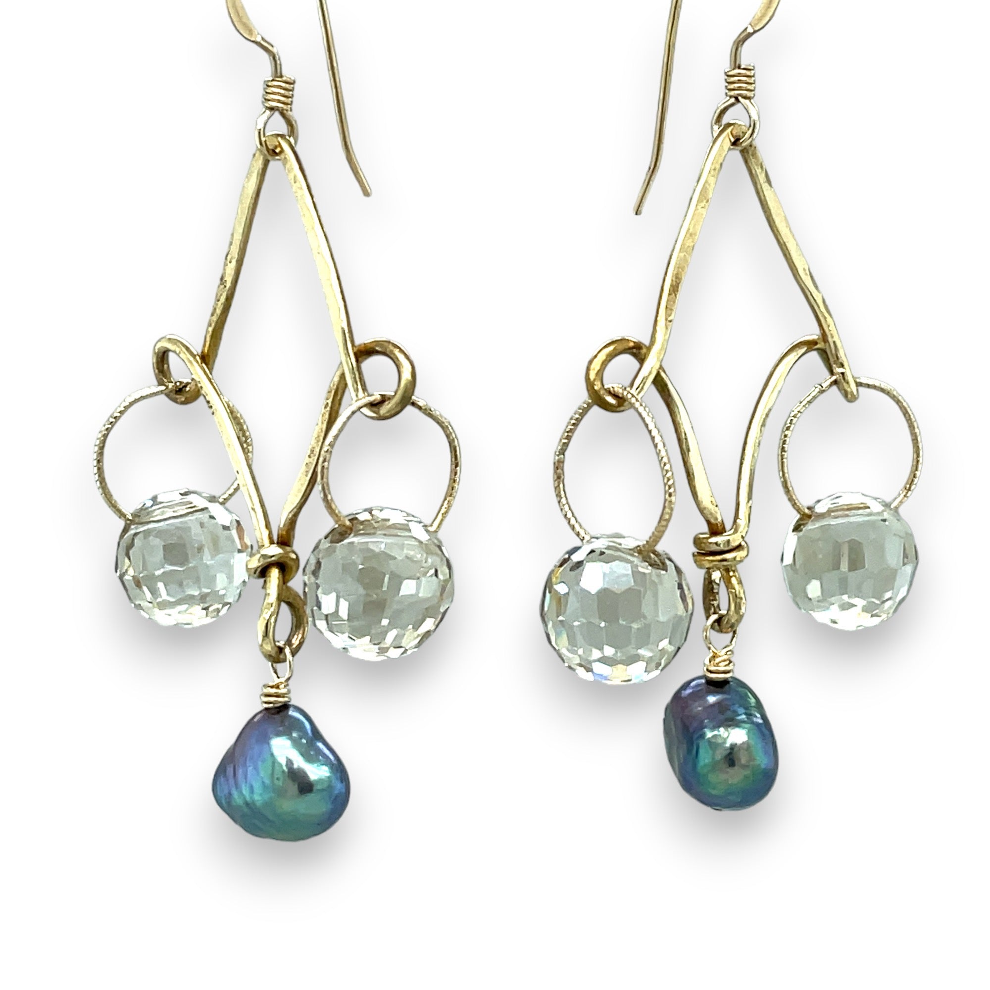 A pair of brass chandelier earrings with champagne color crystal bubbles and peacock blue gray fresh water pearls.
