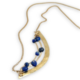 Brass hammered arch necklace with lapis faceted gemstone variety on gold filled chain