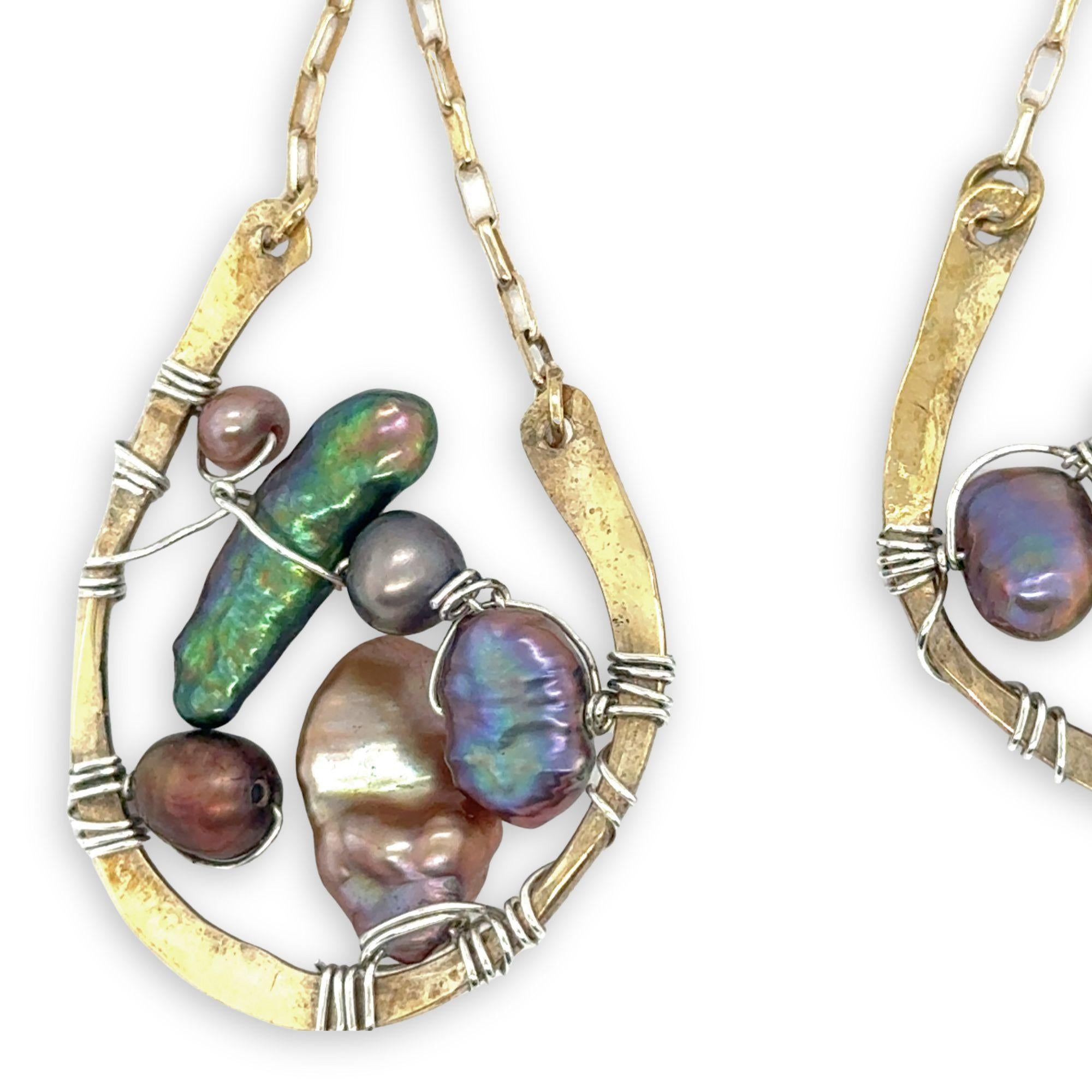 multi color fresh water pearl collection inside open hammered brass hoop earrings hanging from gold filled box chain