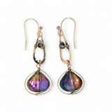 A pair of gold-filled wrapped fuchsia two-toned hematite crystal drop earrings with a hammered bronze mini drop and a crystal accent on gold filled earring hooks