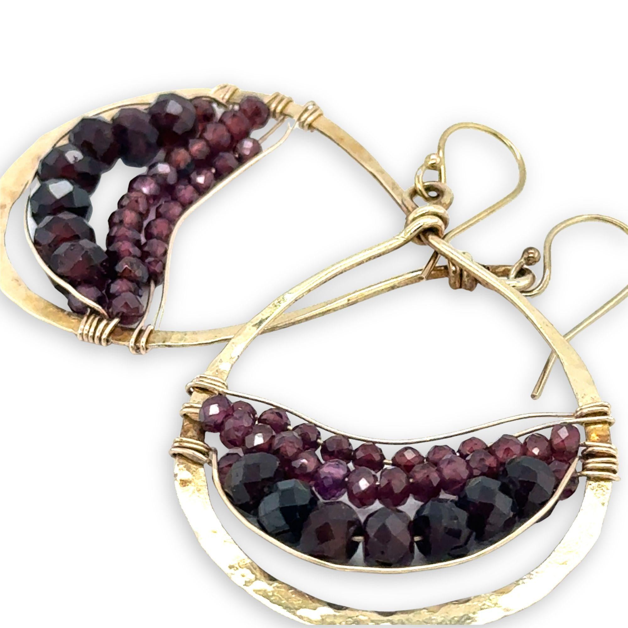 Fat hammered brass drop earrings layered with faceted garnet gemstone variety in gold filled wire