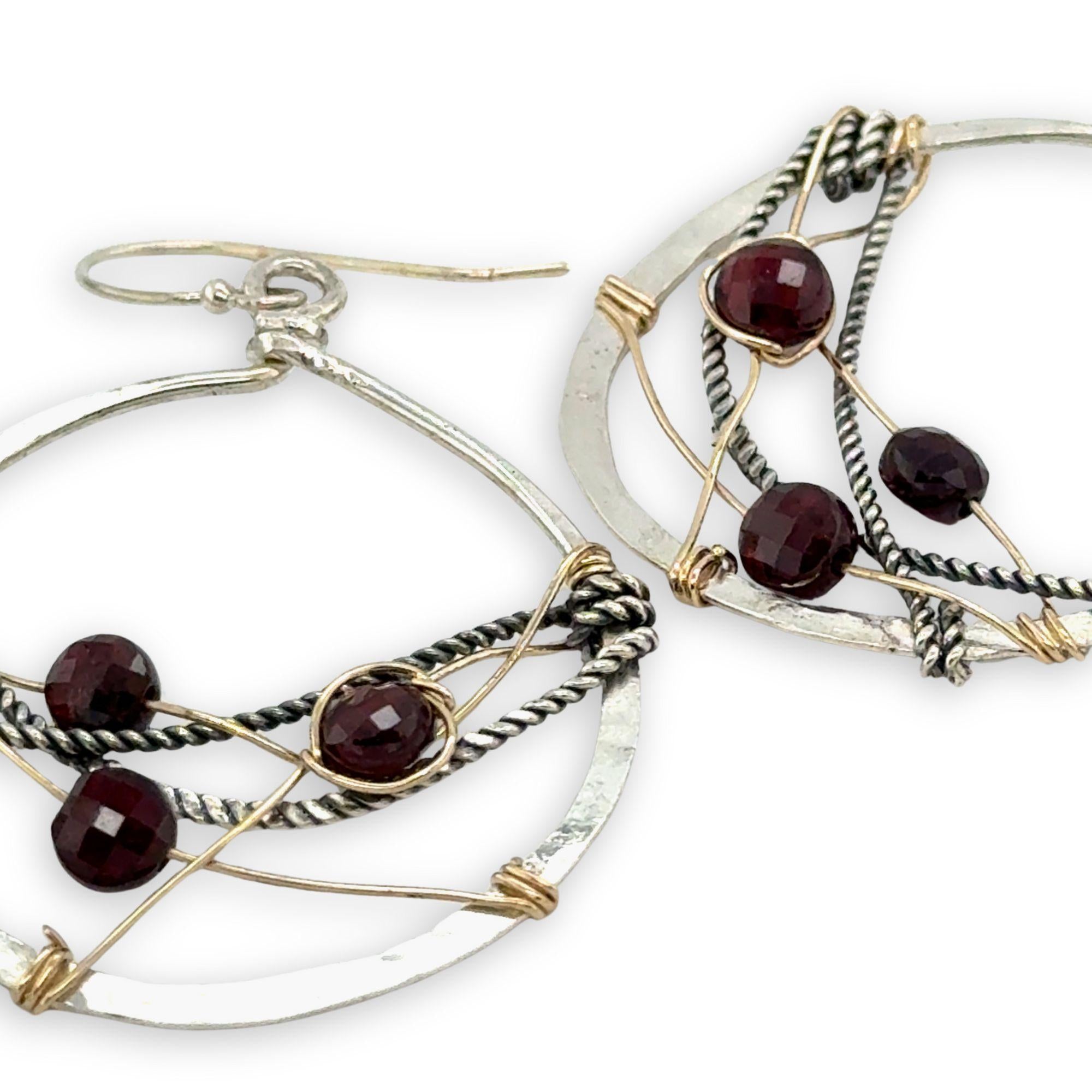 handmade sterling silver hoops with garnet faceted coins, gold-filled wire and darkened sterling silver twisted wire twisted within