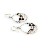 handmade sterling silver hoops with garnet faceted coins, gold-filled wire and darkened sterling silver twisted wire twisted within