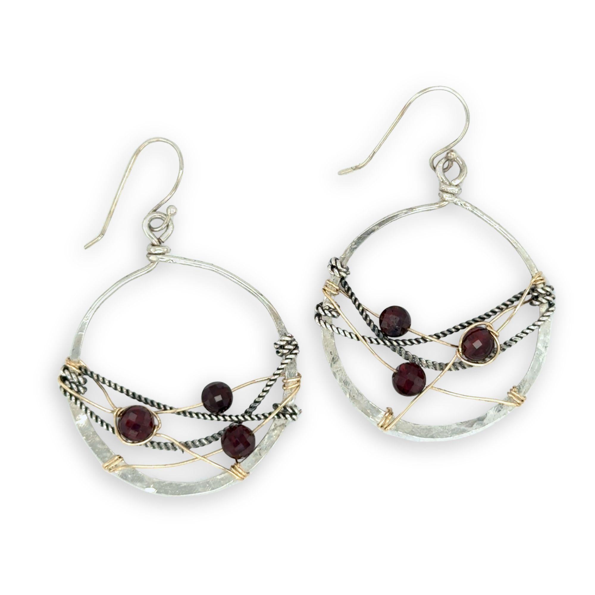 handmade sterling silver hoops with garnet faceted coins, gold-filled wire and darkened sterling silver twisted wire twisted within