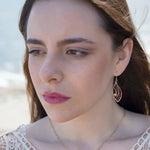 sterling silver mini marquise earrings with brass accents accompanied by garnet gemstones and crystal