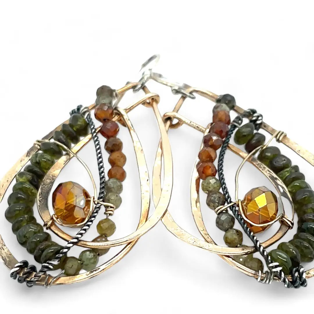 Handmade hammered bronze layered drop earrings with oxidized sterling twist wire, ombre orange to green hessonite and vesuvianite gemstones with an orange sparkling crystal accent