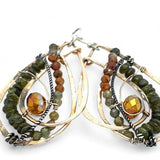 Handmade hammered bronze layered drop earrings with oxidized sterling twist wire, ombre orange to green hessonite and vesuvianite gemstones with an orange sparkling crystal accent