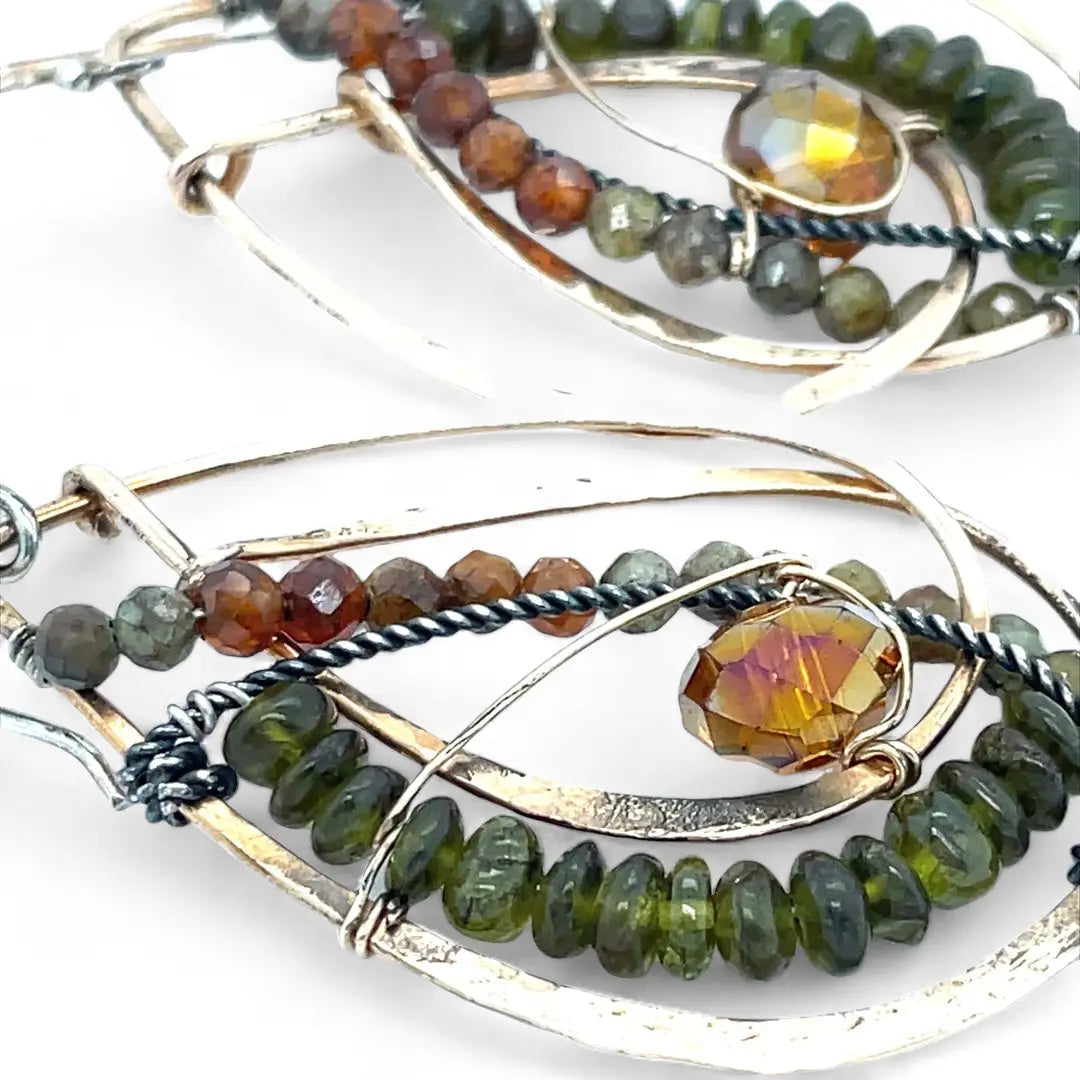 Handmade hammered bronze layered drop earrings with oxidized sterling twist wire, ombre orange to green hessonite and vesuvianite gemstones with an orange sparkling crystal accent