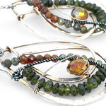 Handmade hammered bronze layered drop earrings with oxidized sterling twist wire, ombre orange to green hessonite and vesuvianite gemstones with an orange sparkling crystal accent