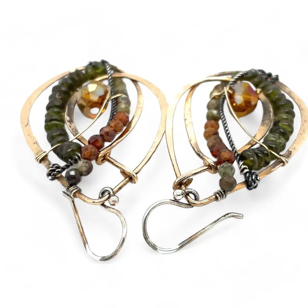 Handmade hammered bronze layered drop earrings with oxidized sterling twist wire, ombre orange to green hessonite and vesuvianite gemstones with an orange sparkling crystal accent