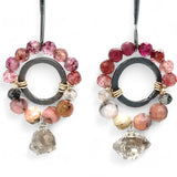 Darkened sterling silver ring surrounded by pink tourmaline and opal gemstones with a herkimer diamond dangle, attached to a darkened sterling silver twisted bar top earring