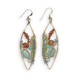 Green amethyst nuggets surrounded by labradorite, hessonite garnet, citrine, crystal, and amazonite gemstones wrapped in sterling silver and brass twist wires on a handmade hammered brass marquise earrings