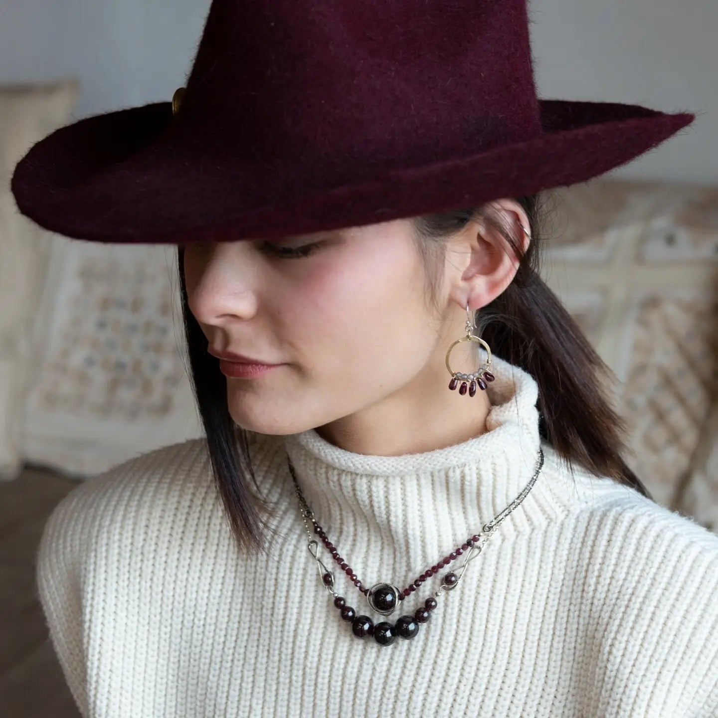 Smooth garnet sphere gemstones are suspended between handmade sterling silver hammered teardrops on sterling rolo chain necklace