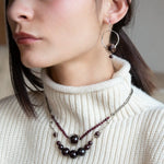 Smooth garnet sphere gemstones are suspended between handmade sterling silver hammered teardrops on sterling rolo chain necklace