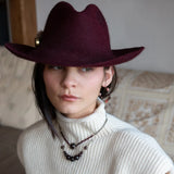 Smooth garnet sphere gemstones are suspended between handmade sterling silver hammered teardrops on sterling rolo chain necklace