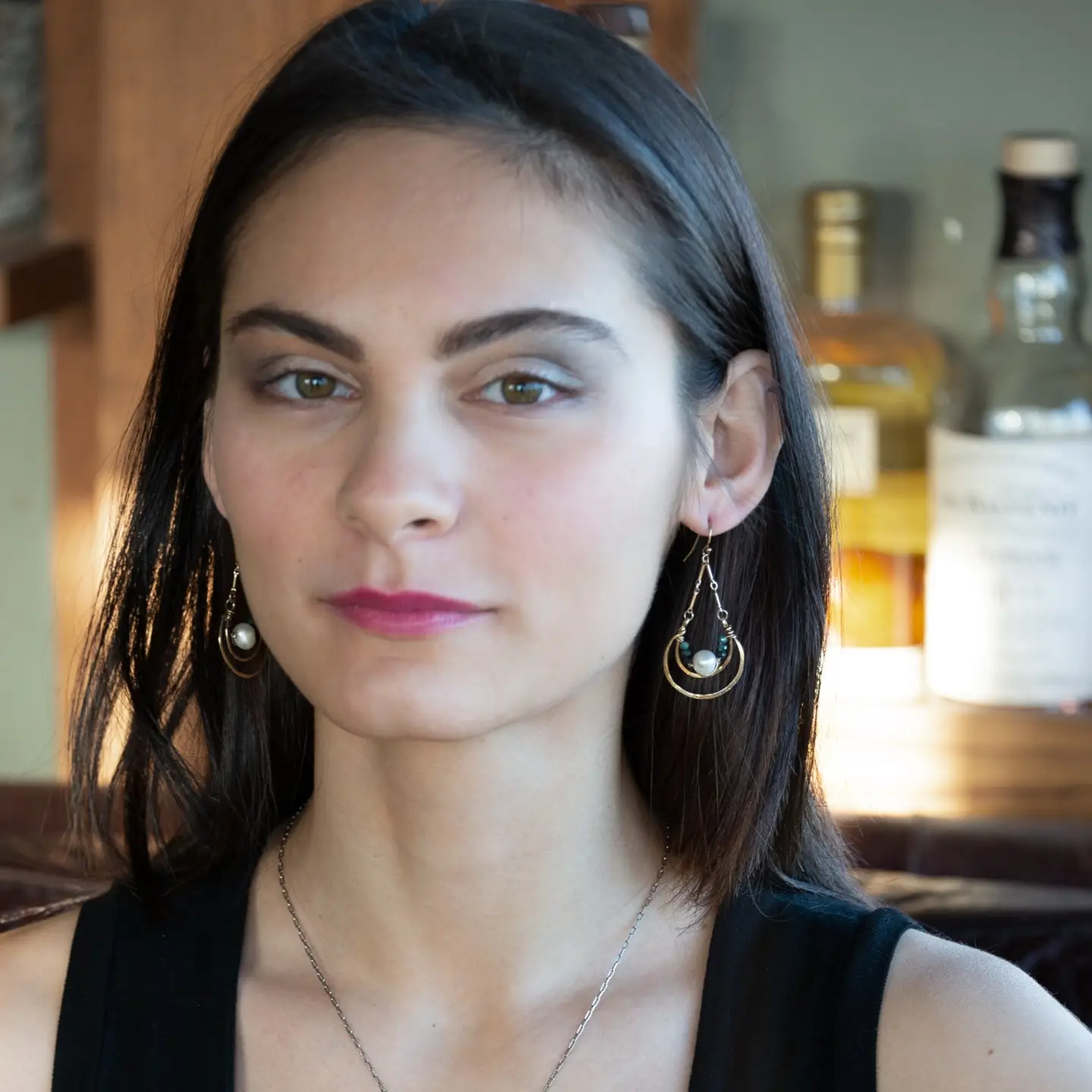 Brass channel hoop earrings lined with round fresh water pearl and blue tourmaline gemstones with gold filled bar chain on top and gold filled earring hooks