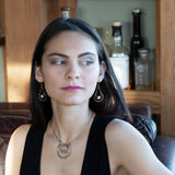 Brass channel hoop earrings lined with round fresh water pearl and blue tourmaline gemstones with gold filled bar chain on top and gold filled earring hooks