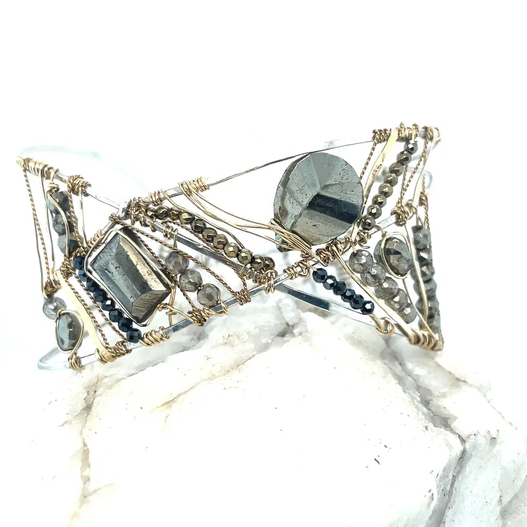 Variety of pyrite gemstones embroider a statement sterling silver handmade cuff bracelet, woven with gold filled and brass twist wires