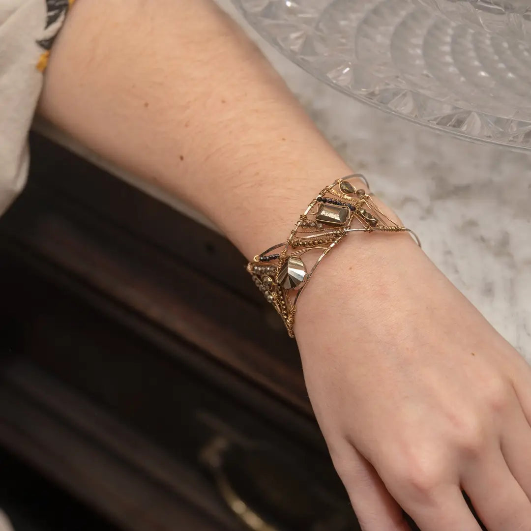 Variety of pyrite gemstones embroider a statement sterling silver handmade cuff bracelet, woven with gold filled and brass twist wires
