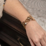 Variety of pyrite gemstones embroider a statement sterling silver handmade cuff bracelet, woven with gold filled and brass twist wires