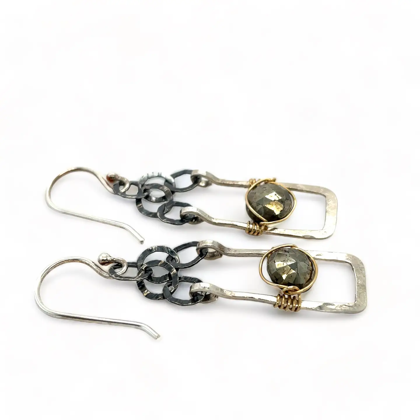 Sterling silver mini rectangle earrings holding faceted pyrite coin gemstones wrapped in gold filled wire, hanging from darkened sterling silver crinkle chain 