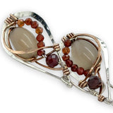 Small sterling silver hammered drop earrings embellished with glowing smooth moonstone oval wrapped in bronze wire and faceted hessonite gemstones