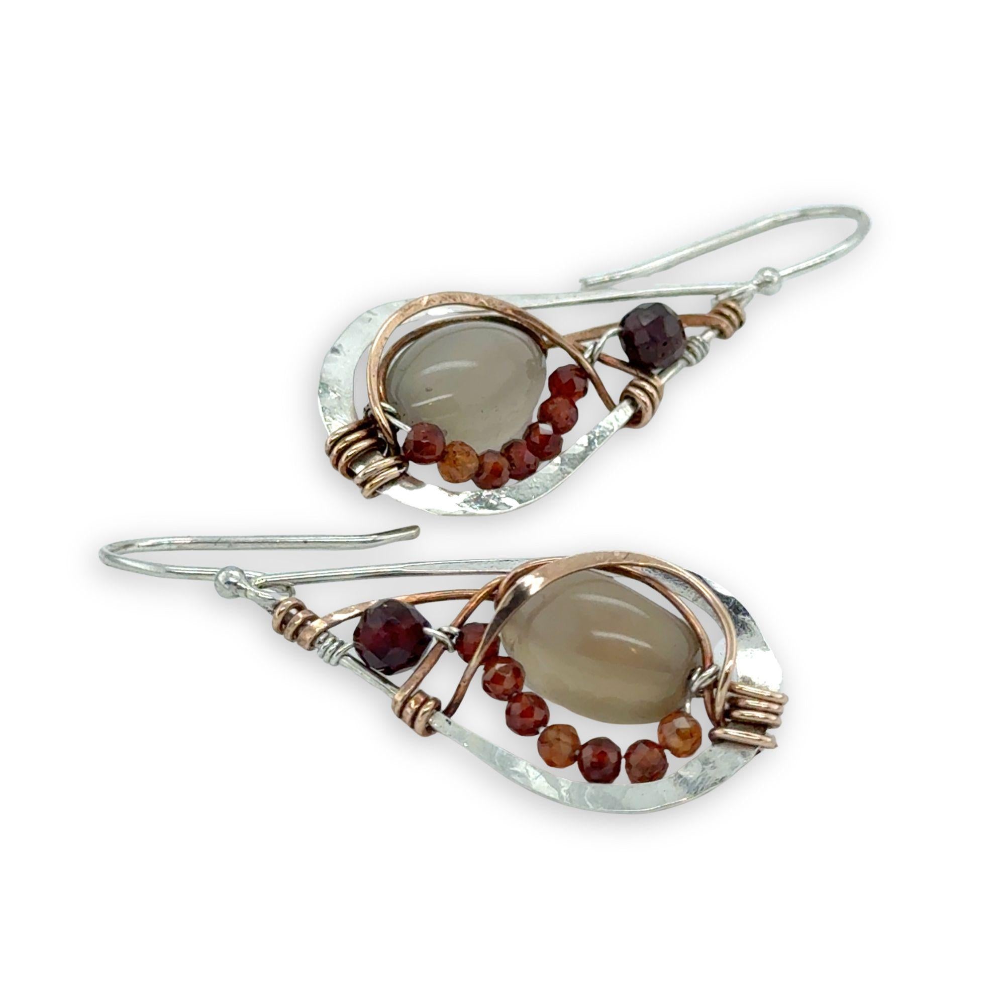 Small sterling silver hammered drop earrings embellished with glowing smooth moonstone oval wrapped in bronze wire and faceted hessonite gemstones