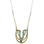 Handmade brass and sterling silver horseshoe pendant beaded with chrysocolla, turquoise, and blue quartz on a mixed sterling silver and gold filled chain