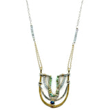 Handmade brass and sterling silver horseshoe pendant beaded with chrysocolla, turquoise, and blue quartz on a mixed sterling silver and gold filled chain