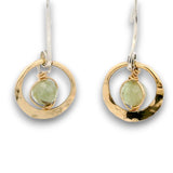 Tiny hammered brass hoops with green kyanite gemstones in center wrapped in 14k gold filled wire, hanging from handmade sterling silver long hook earrings