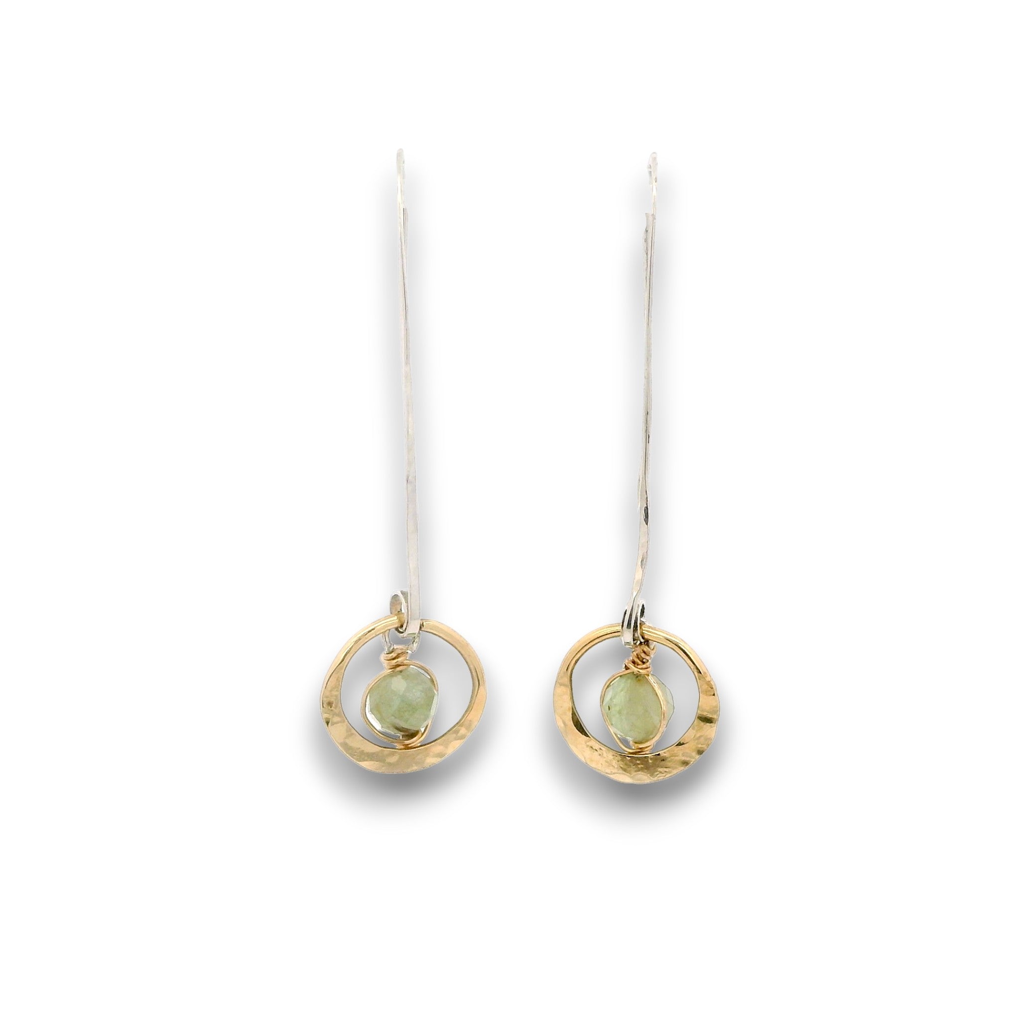 Tiny hammered brass hoops with green kyanite gemstones in center wrapped in 14k gold filled wire, hanging from handmade sterling silver long hook earrings