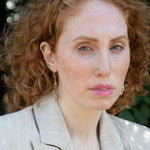 oxidized sterling silver arrow shaped earrings with brass and shiny sterling silver hammered swishes and labradorite gemstones on gold filled wire