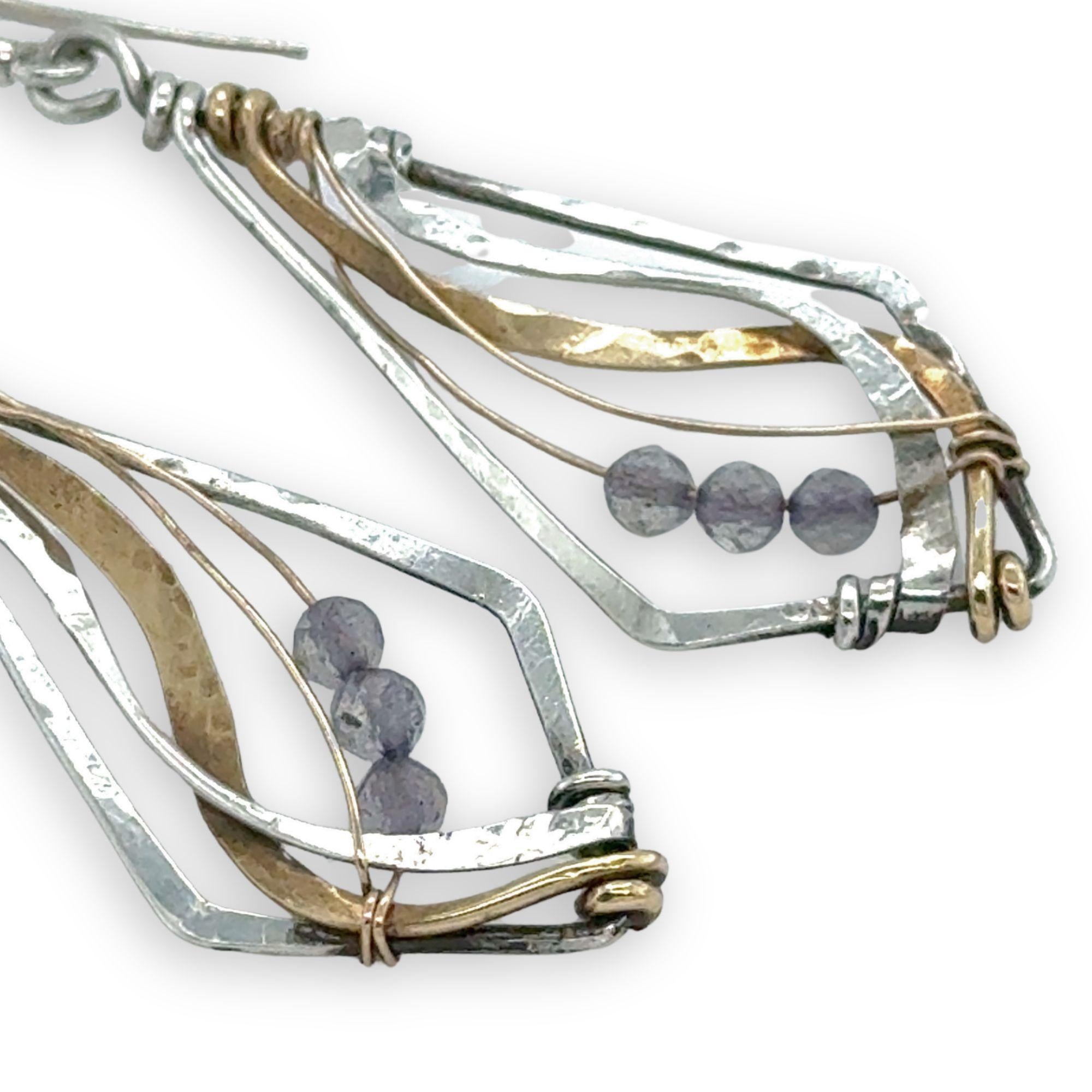 oxidized sterling silver arrow shaped earrings with brass and shiny sterling silver hammered swishes and labradorite gemstones on gold filled wire