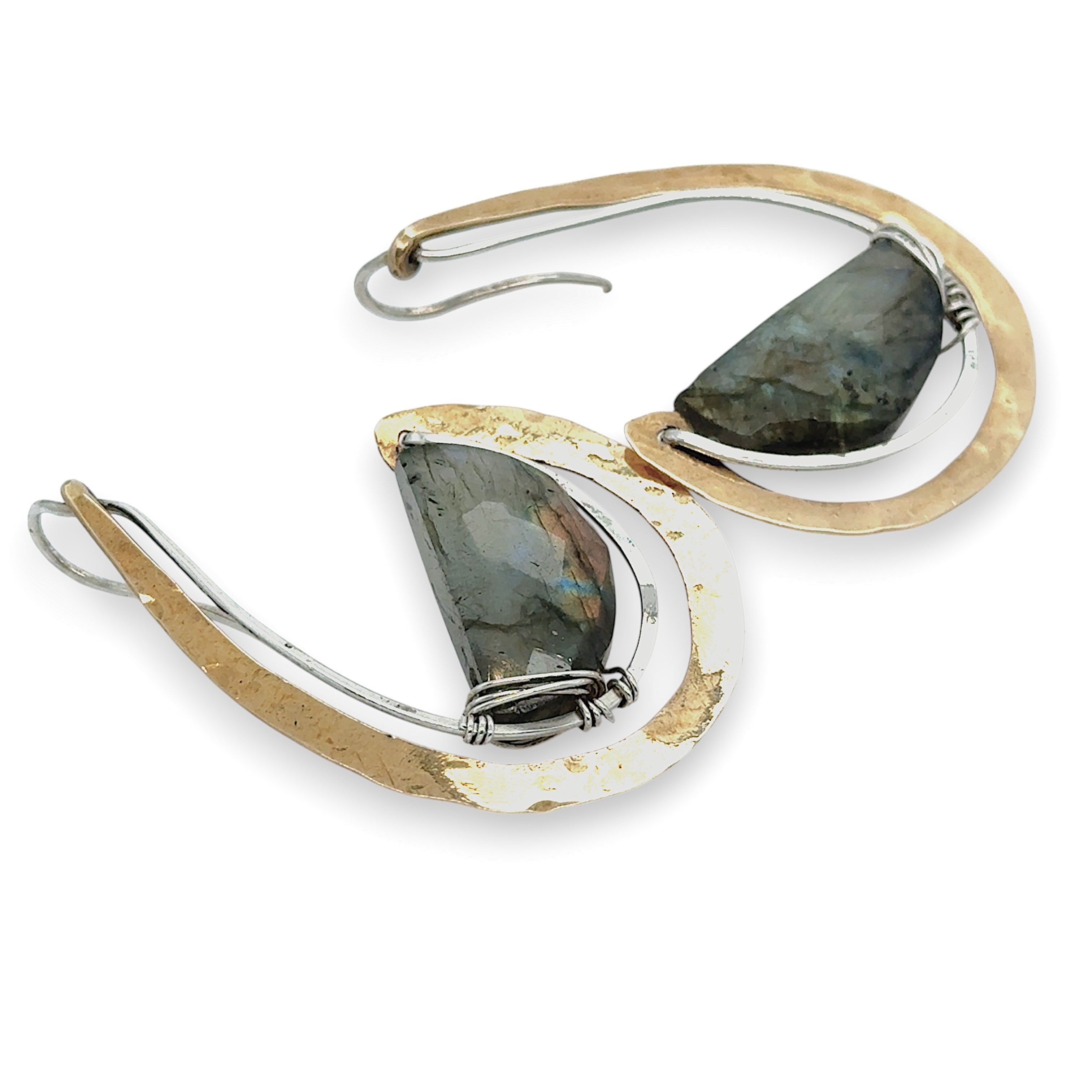Flashy half moon shaped labradorite gemstones sitting inside a layer of sterling silver wire inside a large hammered brass hook earring with built in earring hooks to wear like a post earring