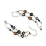 Copper, purple, and indigo blue fresh water pearls, cat's eye and lapis gemstones are suspended between two mini sterling silver hammered arch earrings