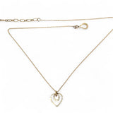 A mini gold-filled heart charm pendant necklace with a hammered texture and an adjustable delicate gold filled chain.