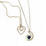 A mini gold-filled heart charm pendant necklace with a hammered texture and an adjustable delicate gold filled chain.