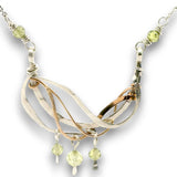 Hammered sterling silver and bronze wire waves pendant with green cubic zirconia dangles and a sparkly sterling silver tube chain necklace