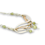 Hammered sterling silver and bronze wire waves pendant with green cubic zirconia dangles and a sparkly sterling silver tube chain necklace